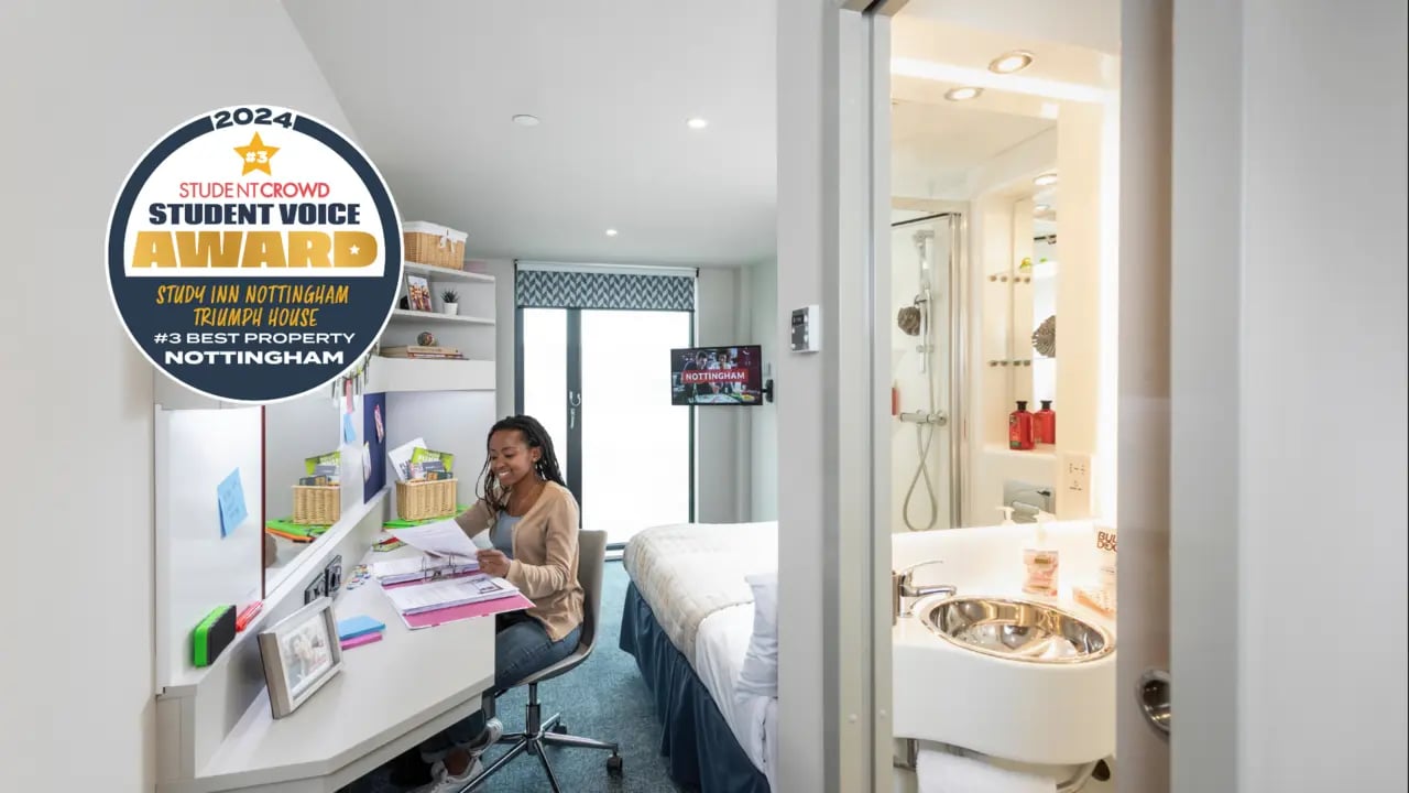 Award badge woman studying bed bathroom interior at Triumph House in Nottingham Student Accommodation