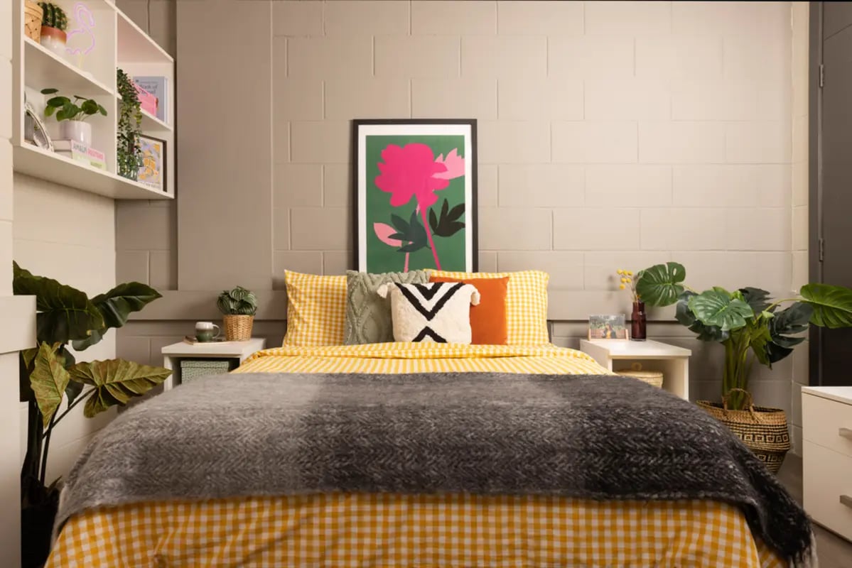 Bed with yellow gingham bedding art bedroom at Spring Gardens in Aberdeen Student Accommodation