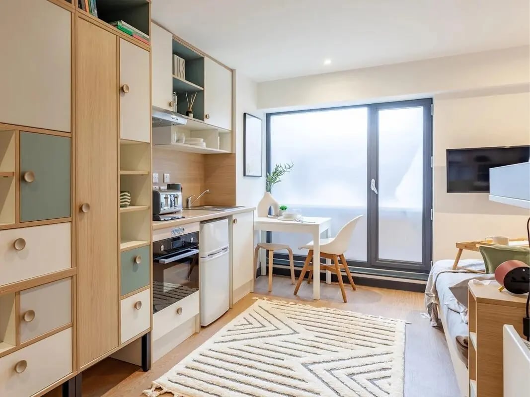 Kitchen with dining table and living area Kitchen living room at The Gorge in Exeter Student Accommodation