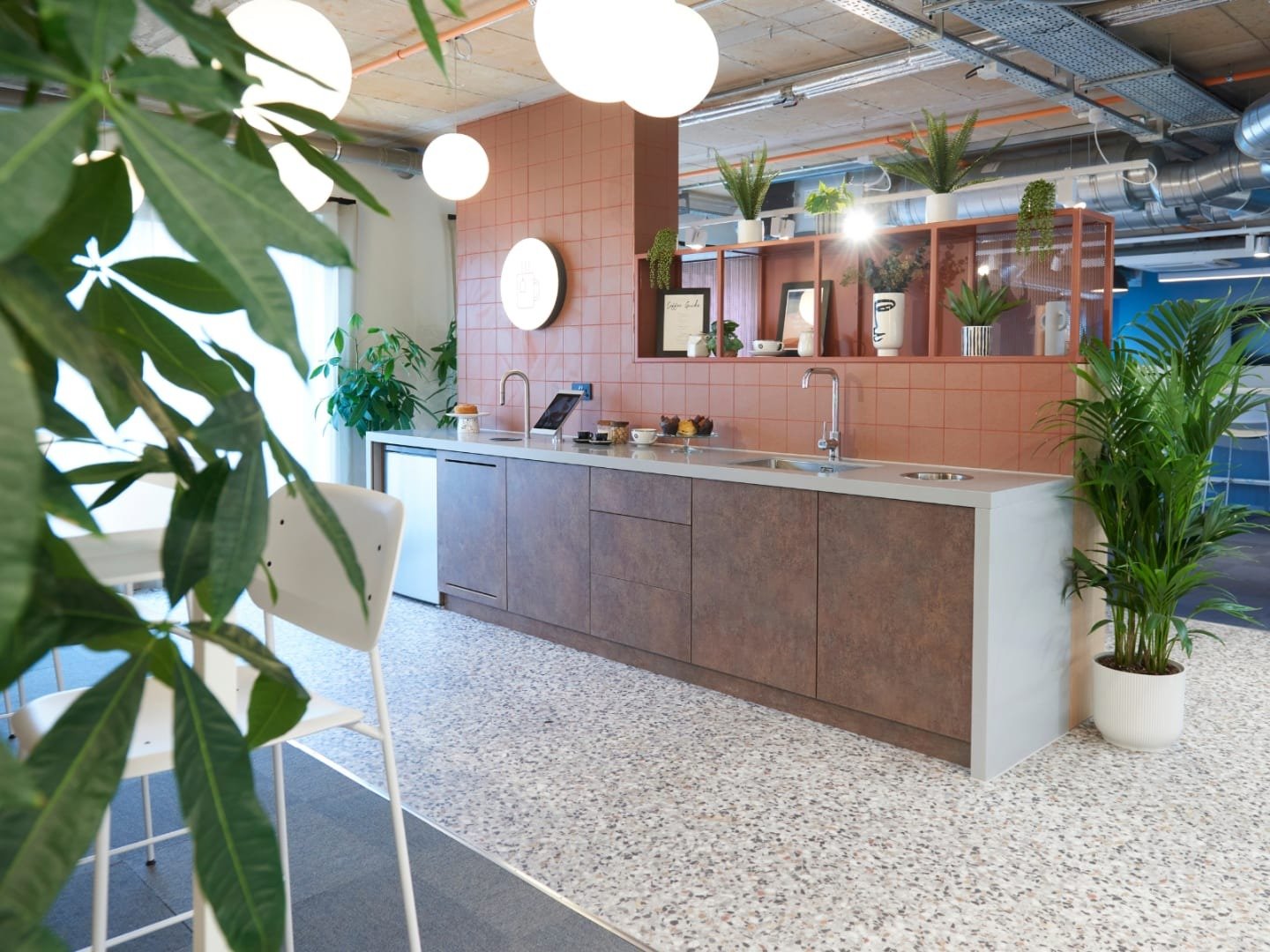 Modern kitchen with island plants and seating kitchen at The Gorge in Exeter Student Accommodation