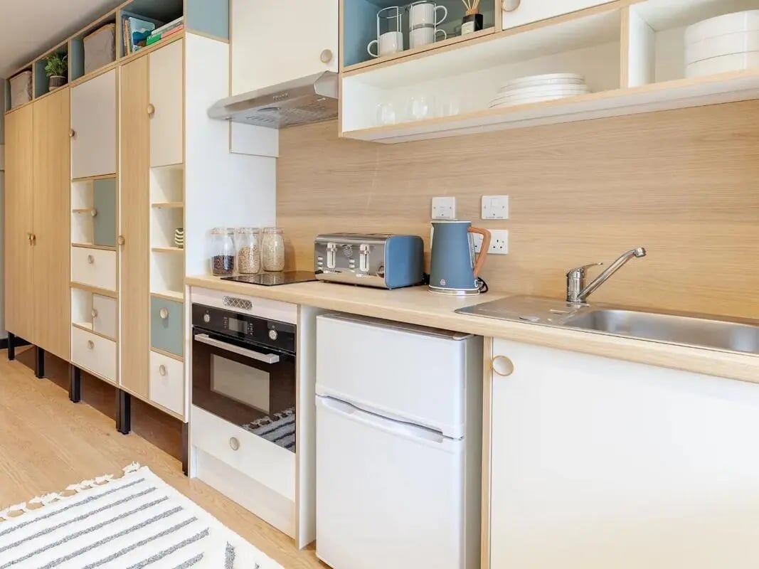 Kitchen cabinets toaster kettle fridge oven sink kitchen at The Gorge in Exeter Student Accommodation
