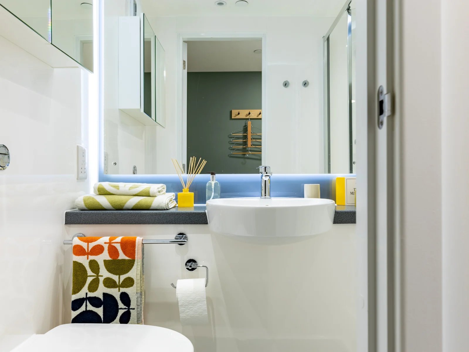 Sink towels soap dispenser reed diffuser bathroom at Venti House in London Student Accommodation