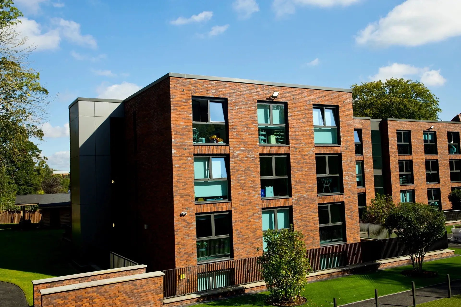 Brick building with many windows exterior at Beechenhurst House in Birmingham Student Accommodation