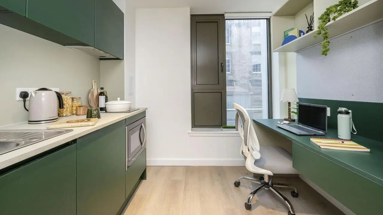 Kitchen desk with laptop and chair living area at St Vincent Studios in Glasgow Student Accommodation