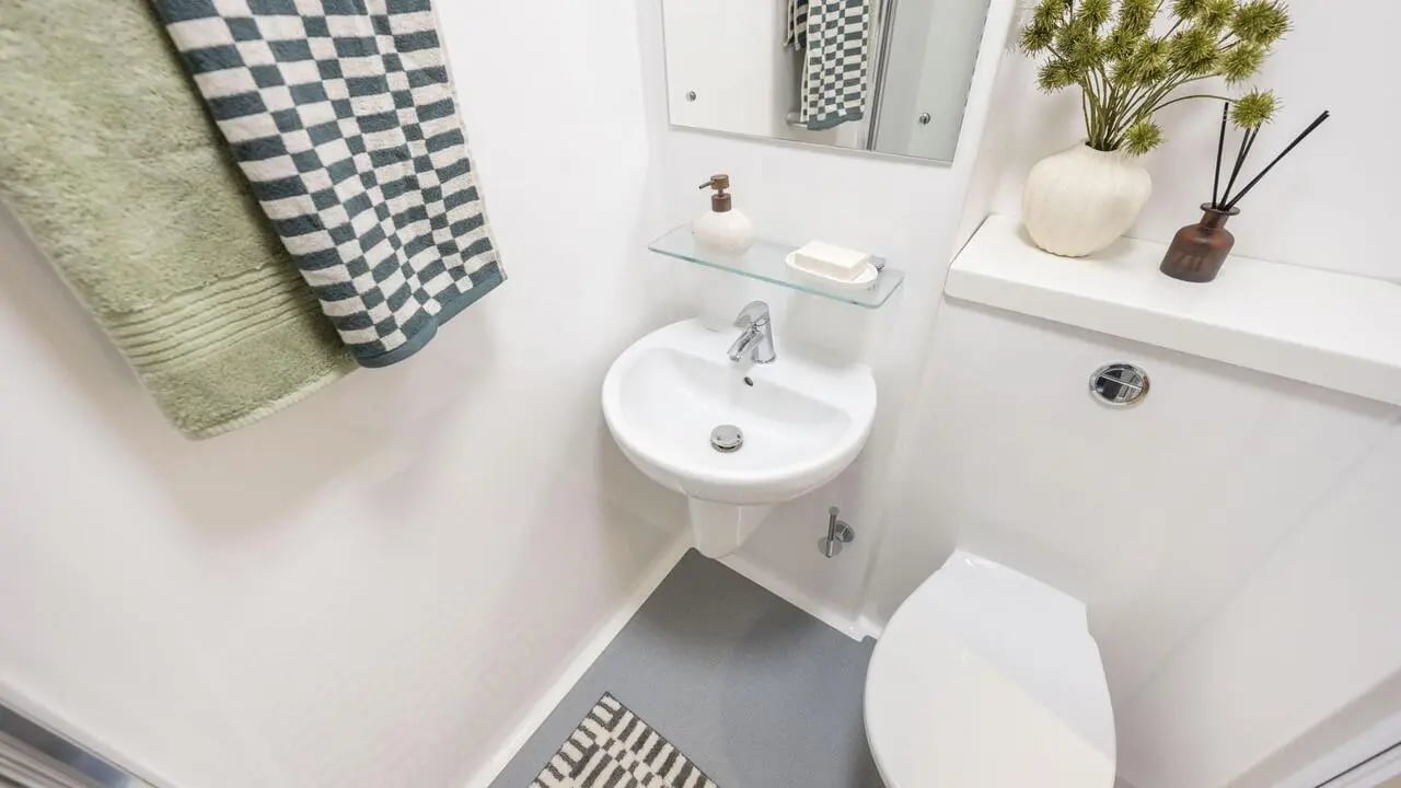 Sink toilet towels and mirror bathroom at St Vincent Studios in Glasgow Student Accommodation