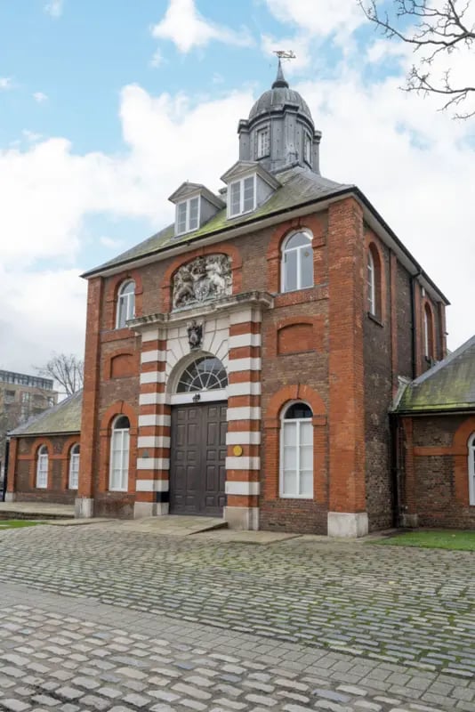 Brick building with grand entrance and dome exterior at Press House in London Student Accommodation