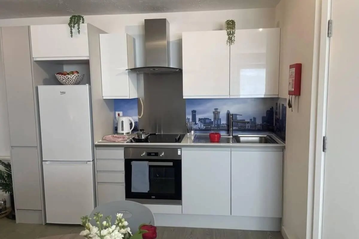 Modern kitchen with fridge oven kettle sink kitchen at Manna Ash House in London Student Accommodation