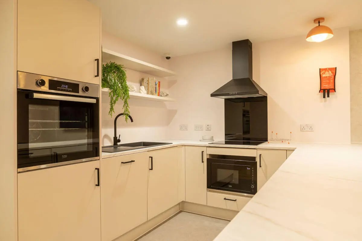 Modern kitchen with oven sink microwave and stove kitchen at Yugo Crown Place in Birmingham Student Accommodation