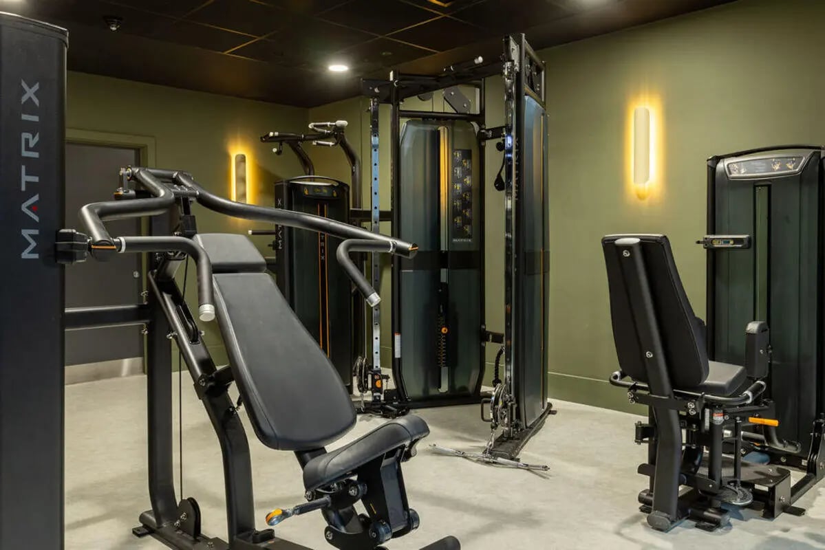 Gym equipment with weights and benches gym at Yugo Crown Place in Birmingham Student Accommodation