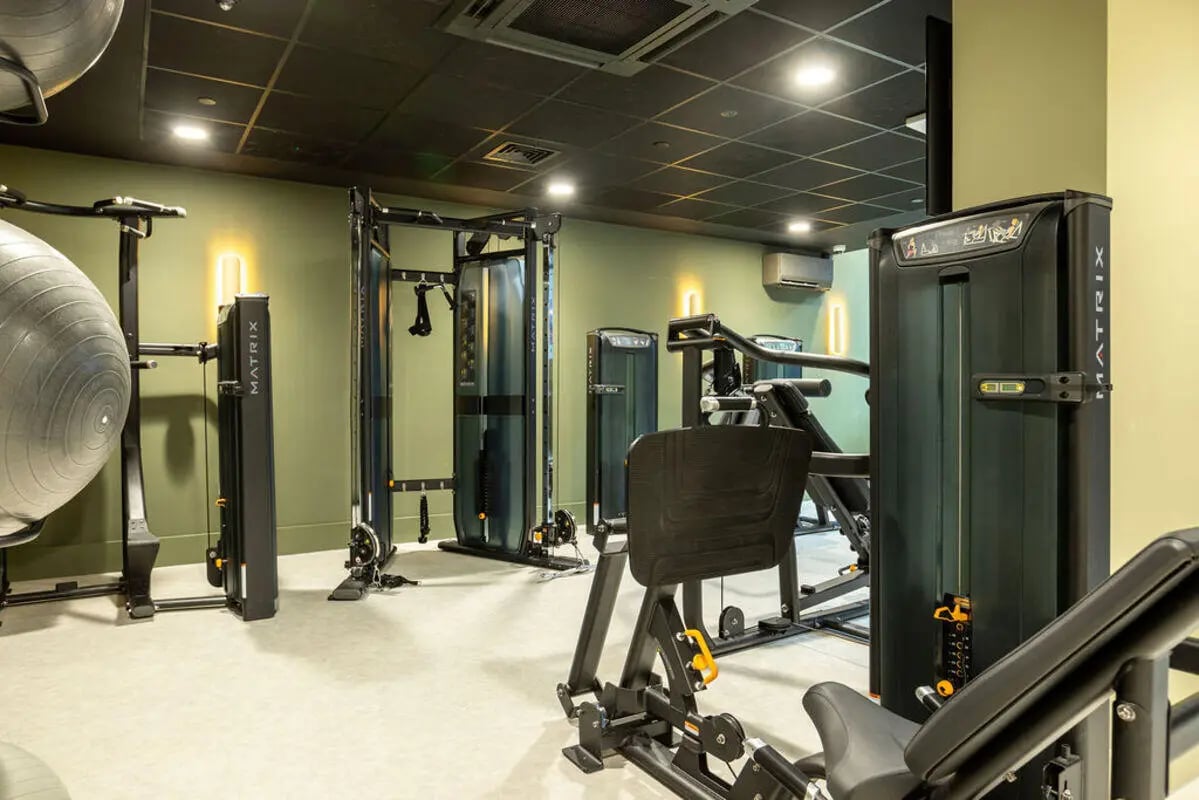 Gym equipment including weight machines and exercise ball Gym at Yugo Crown Place in Birmingham Student Accommodation
