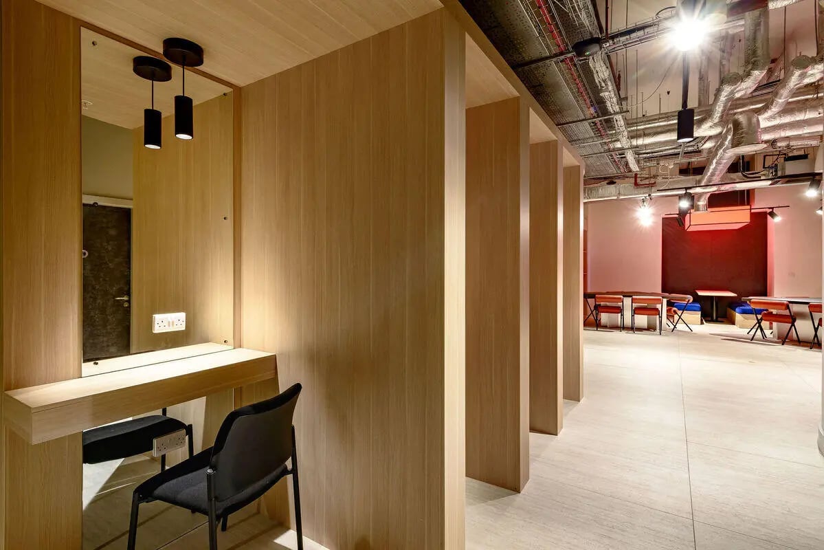 Desk mirror chair seating area communal room at True Nottingham in Nottingham Student Accommodation