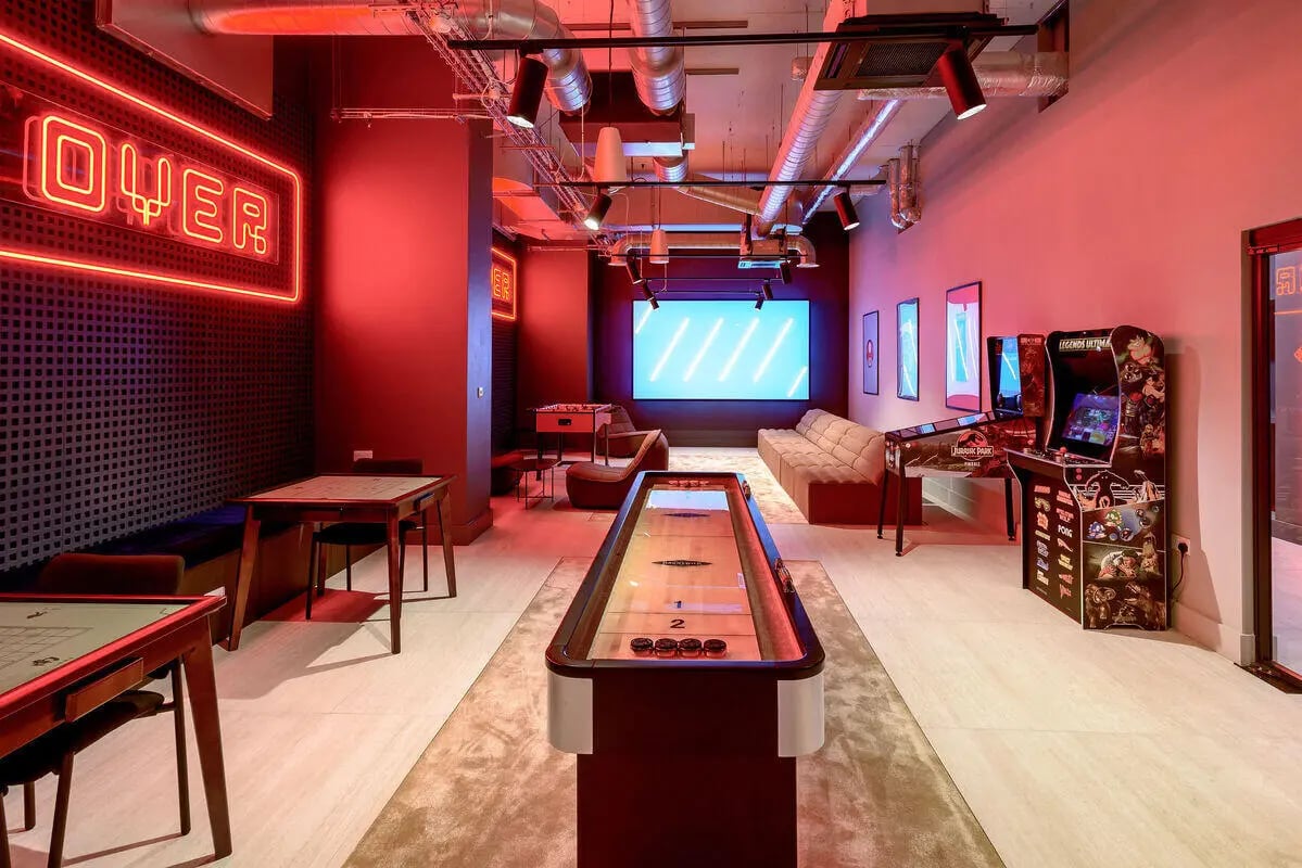 Shuffleboard arcade games neon sign playing area at True Nottingham in Nottingham Student Accommodation