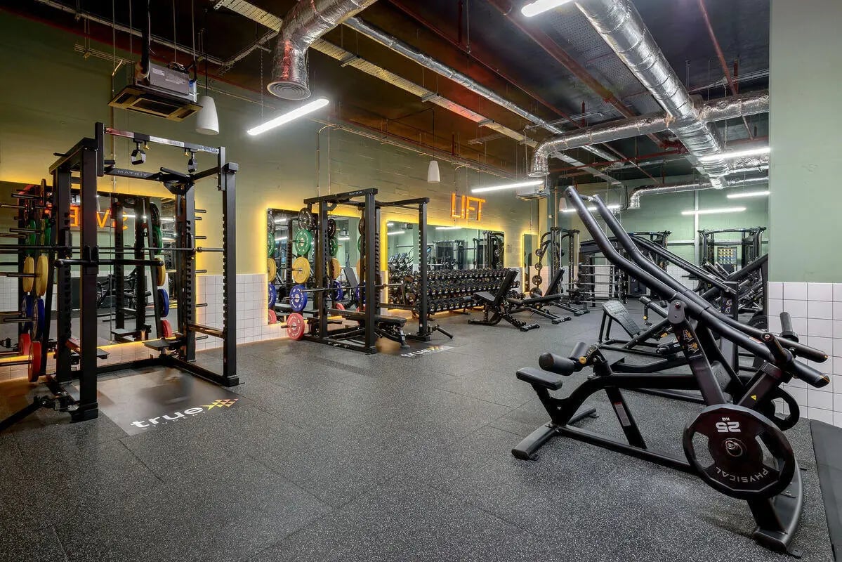 Gym equipment with weights and racks fitness room at True Nottingham in Nottingham Student Accommodation