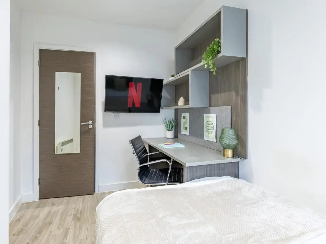 Desk chair TV shelves above desk Bedroom at Centre Gate in Bristol Student Accommodation