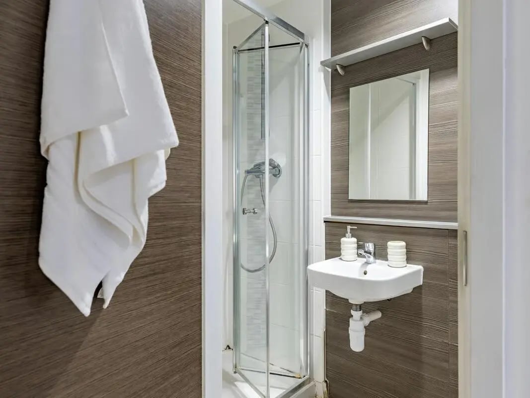 Shower sink mirror and towel bathroom at Centre Gate in Bristol Student Accommodation
