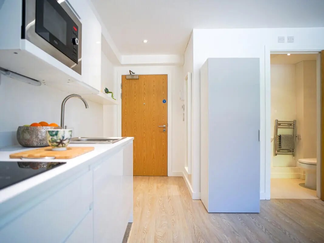 Microwave sink and orange bowl kitchen bathroom at Orme House in Newcastle Under Lyme Student Accommodation