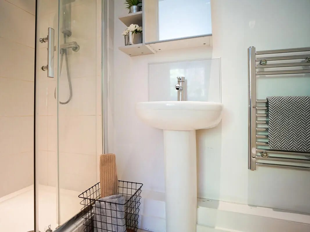 Shower sink basket and towel rack bathroom at Orme House in Newcastle Under Lyme Student Accommodation