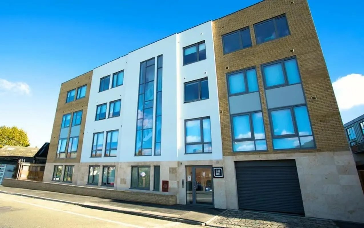 Modern apartment building with large windows exterior at The Cube Greenwich in London Student Accommodation