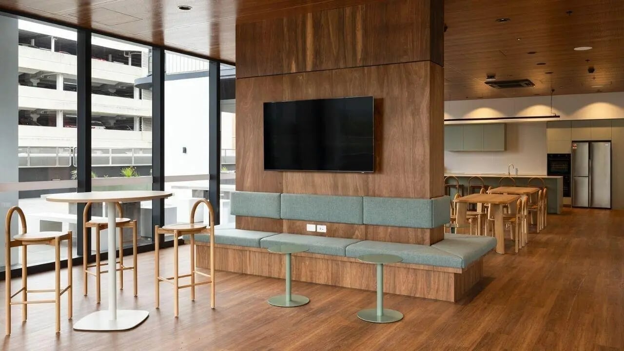 Bench with television and kitchen area living room at UniLodge Perth Central in Perth Student Accommodation