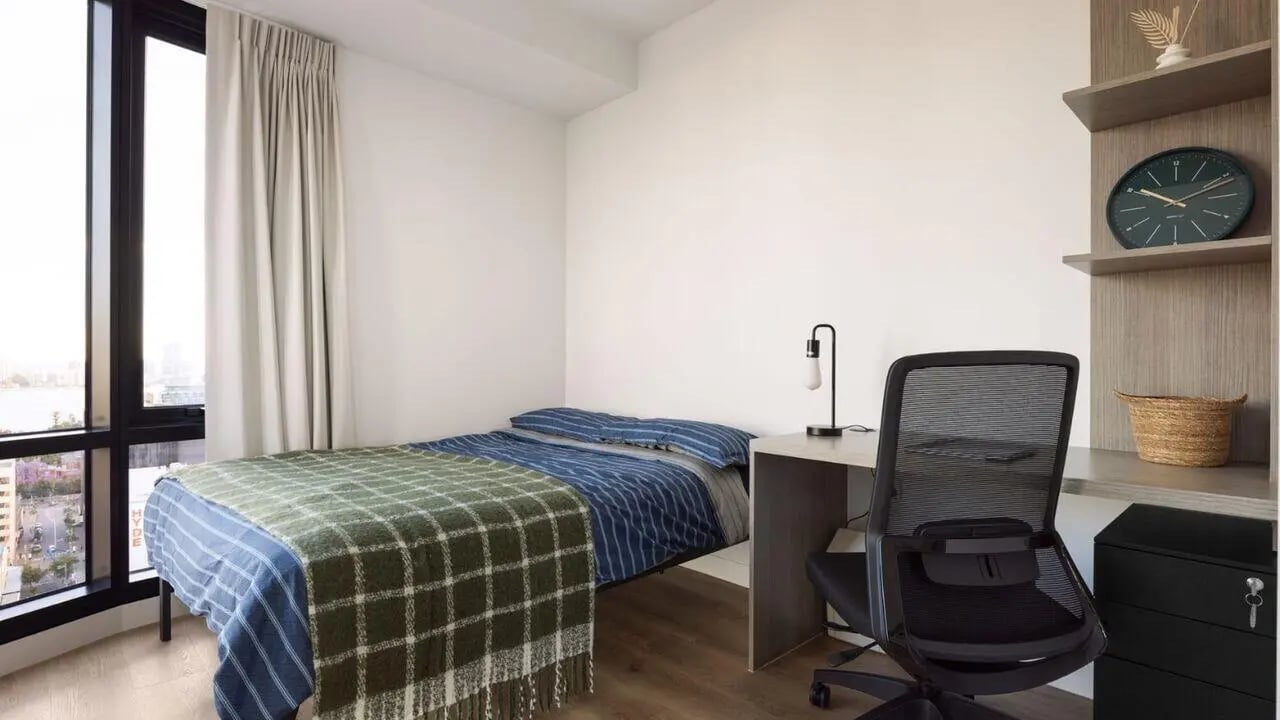 Bed desk chair clock basket bedroom at UniLodge Perth Central in Perth Student Accommodation