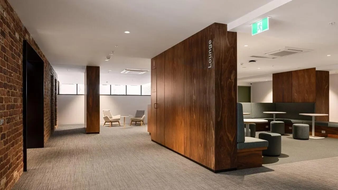 Wooden reception with seating area lounge at UniLodge Perth Central in Perth Student Accommodation