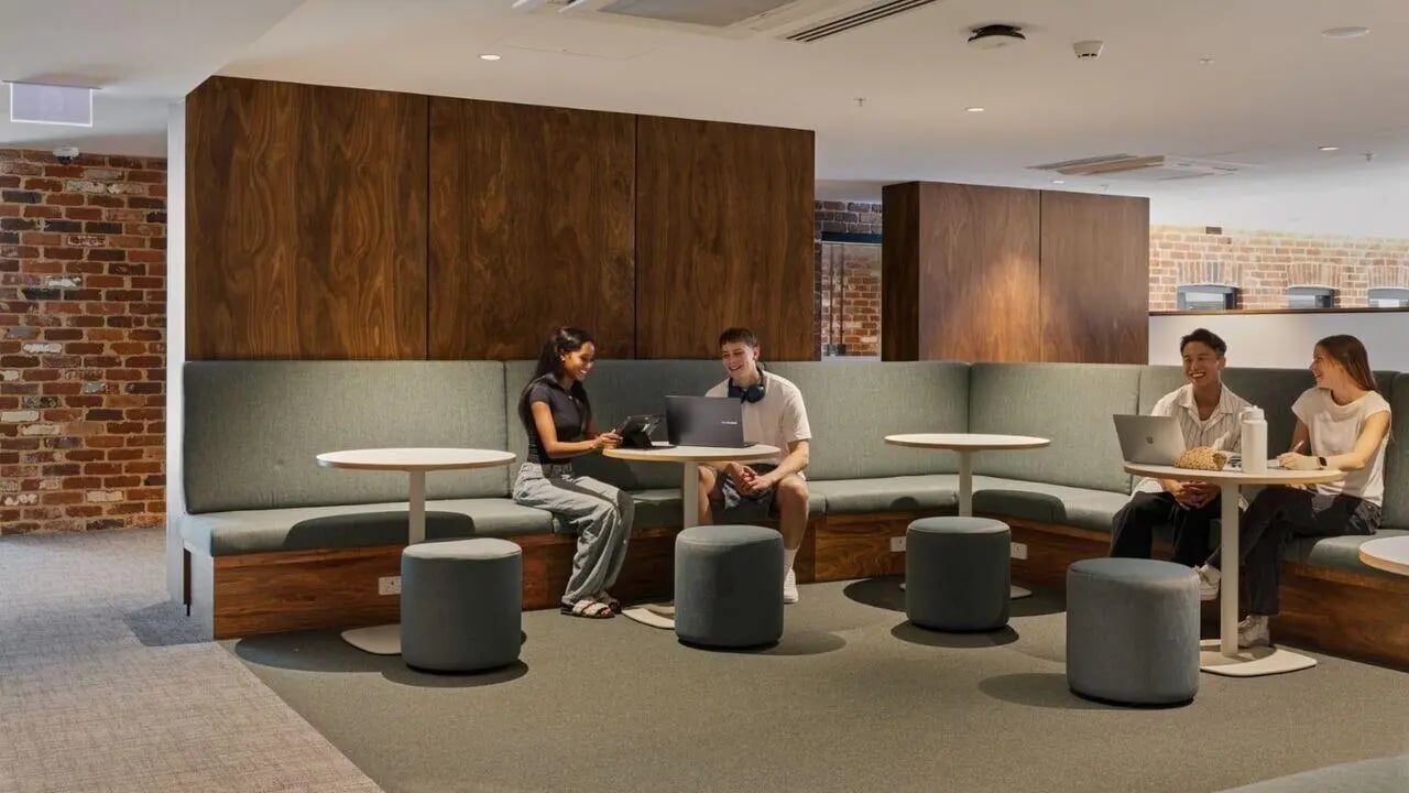 Students studying with laptops on banquette seating area at UniLodge Perth Central in Perth Student Accommodation