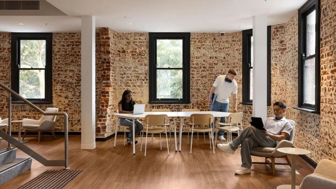 People studying at table and chairs communal space at UniLodge Perth Central in Perth Student Accommodation