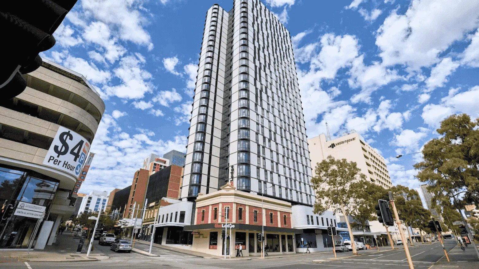Tall white building with many windows exterior at UniLodge Perth Central in Perth Student Accommodation