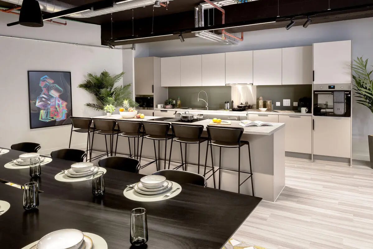 Modern kitchen with island dining area and bar stools kitchen at True Leicester in Leicester Student Accommodation