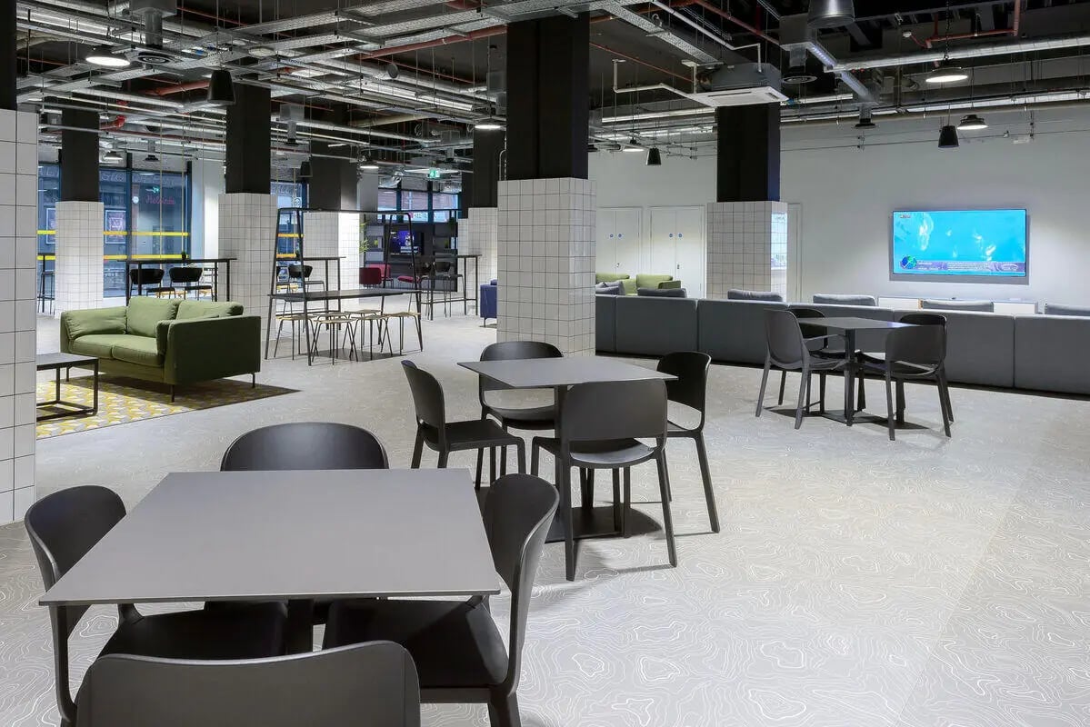 Modern common area with sofas tables and chairs lounge at True Leicester in Leicester Student Accommodation