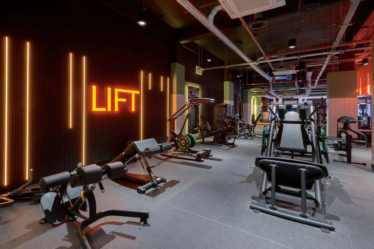 Workout machines neon LIFT sign gym at True Leicester in Leicester Student Accommodation