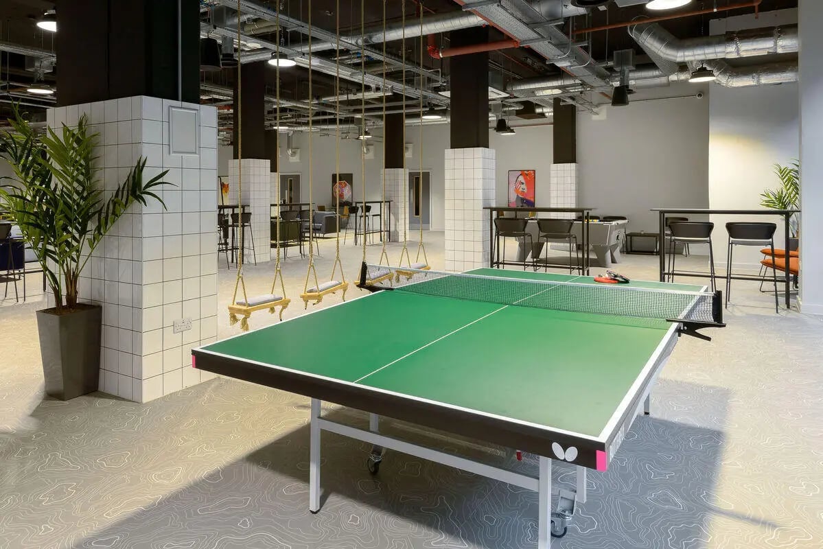 Ping pong table swings and seating area common room at True Leicester in Leicester Student Accommodation