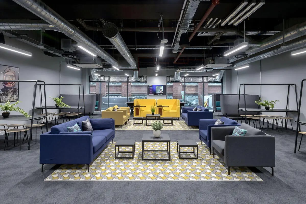 Modern common area with sofas tables and booths living room at True Leicester in Leicester Student Accommodation
