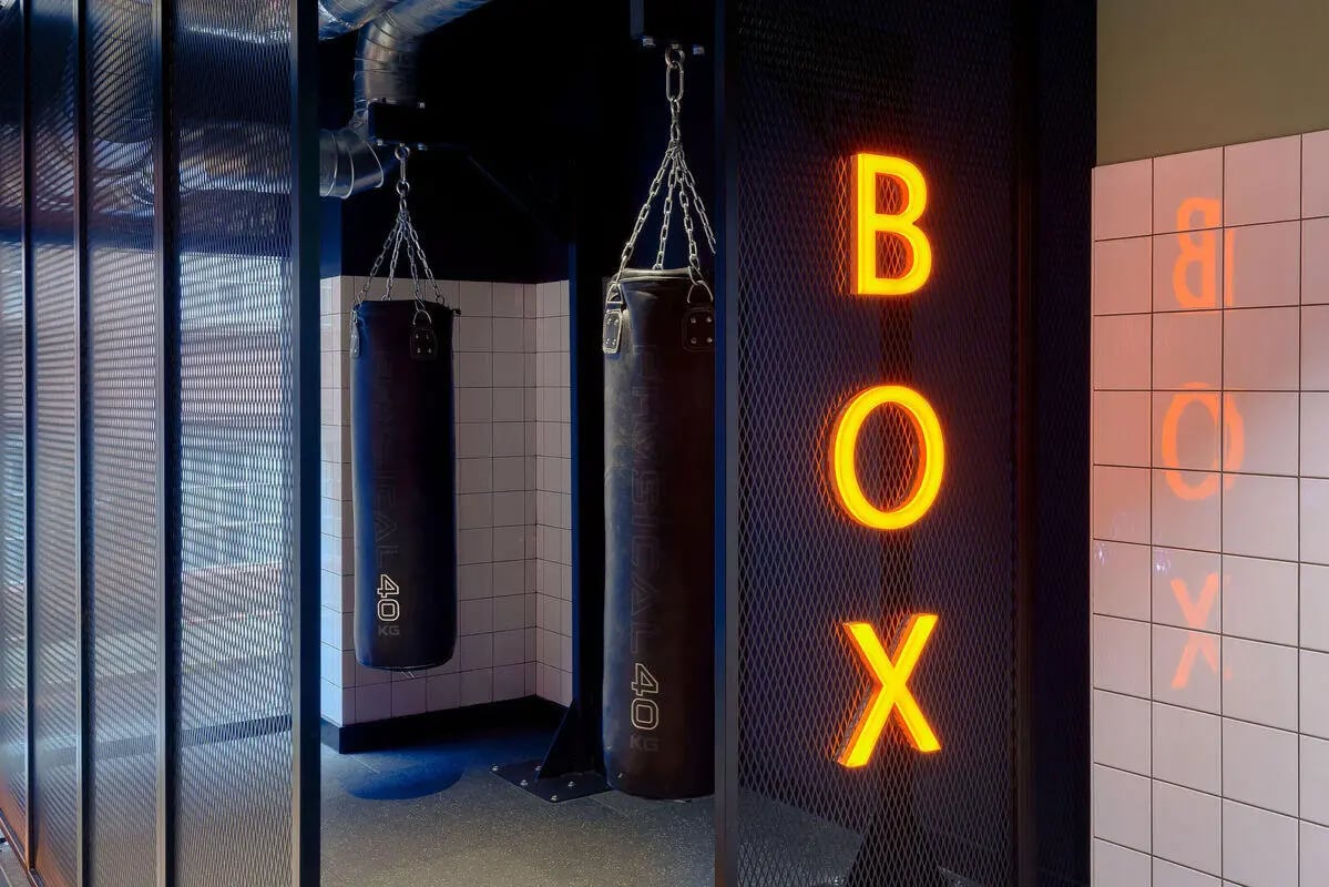 Boxing bags neon letters BOX gym at True Leicester in Leicester Student Accommodation