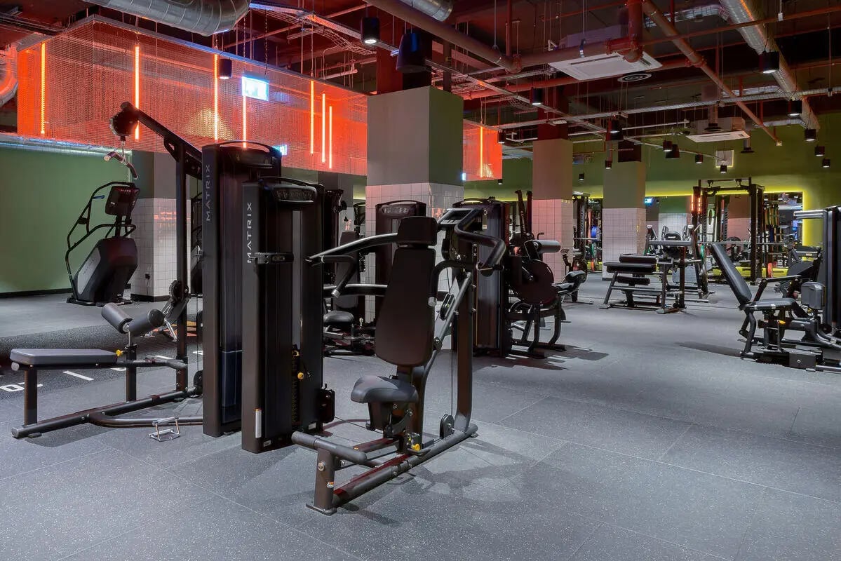 Gym machines with neon lighting gym area at True Leicester in Leicester Student Accommodation