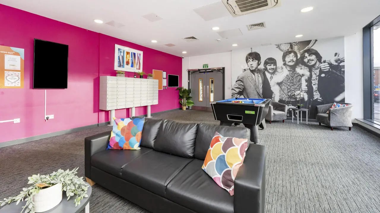 Black couch pool table Beatles mural living room at Glassworks - Liverpool in Liverpool Student Accommodation