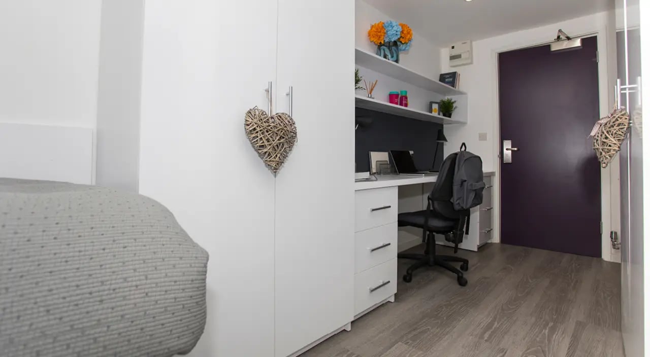 Wardrobe bed desk chair and door study area at The Cube Ealing in London Student Accommodation