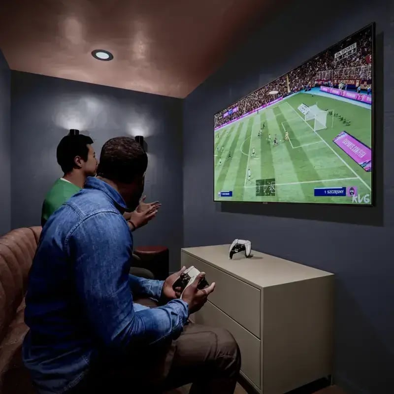 Two students playing video game on couch playing area at Hawthorne House in London Student Accommodation
