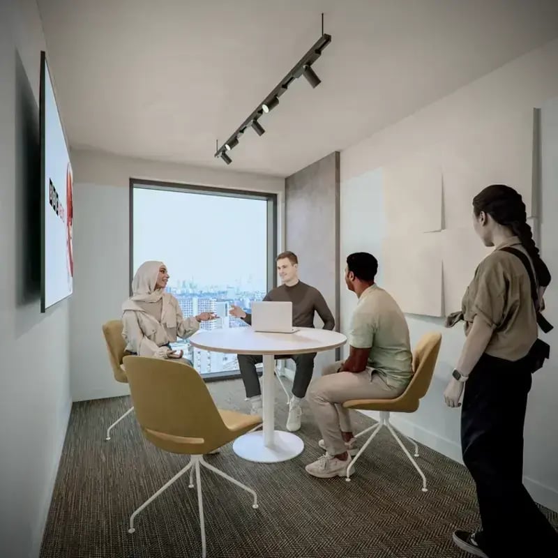 Students around table with laptop collaborative space at Hawthorne House in London Student Accommodation