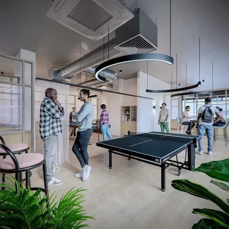 Ping pong table and lounge area students interacting common room at Hawthorne House in London Student Accommodation