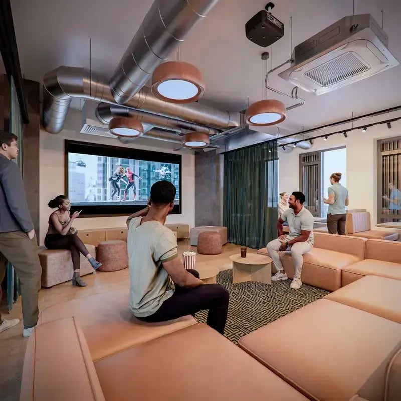 Lounge seating large screen popcorn watching movie living room at Hawthorne House in London Student Accommodation