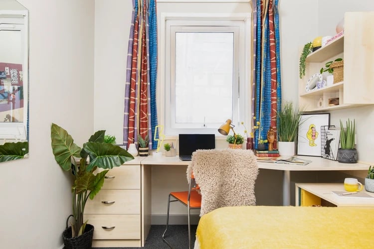 Desk with laptop plants and chair bedroom at Blackfriars in Glasgow Student Accommodation