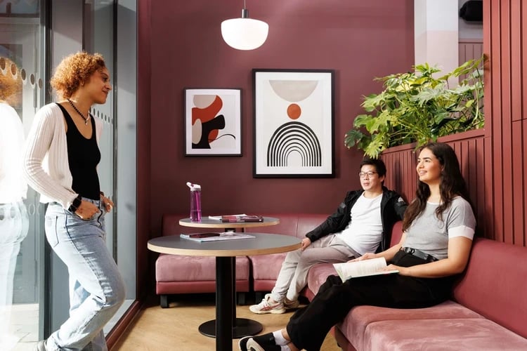 Students chatting in a lounge area at Arch View House in London Student Accommodation