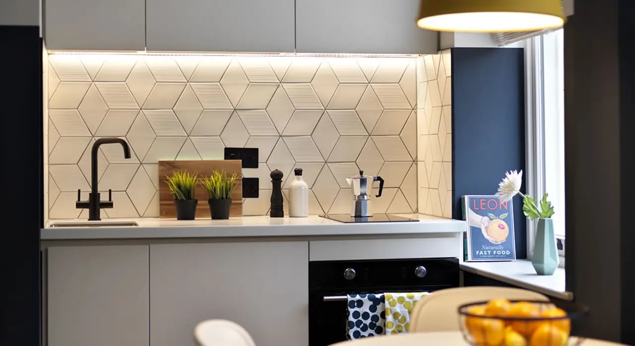 Hexagon tiles sink faucet and stove kitchen at Student Castle Bath in Bath Student Accommodation
