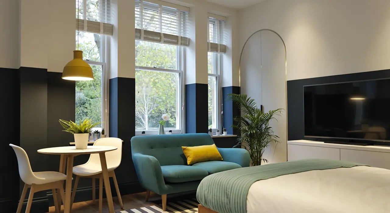 Small sofa and table living room studio at Student Castle Bath in Bath Student Accommodation