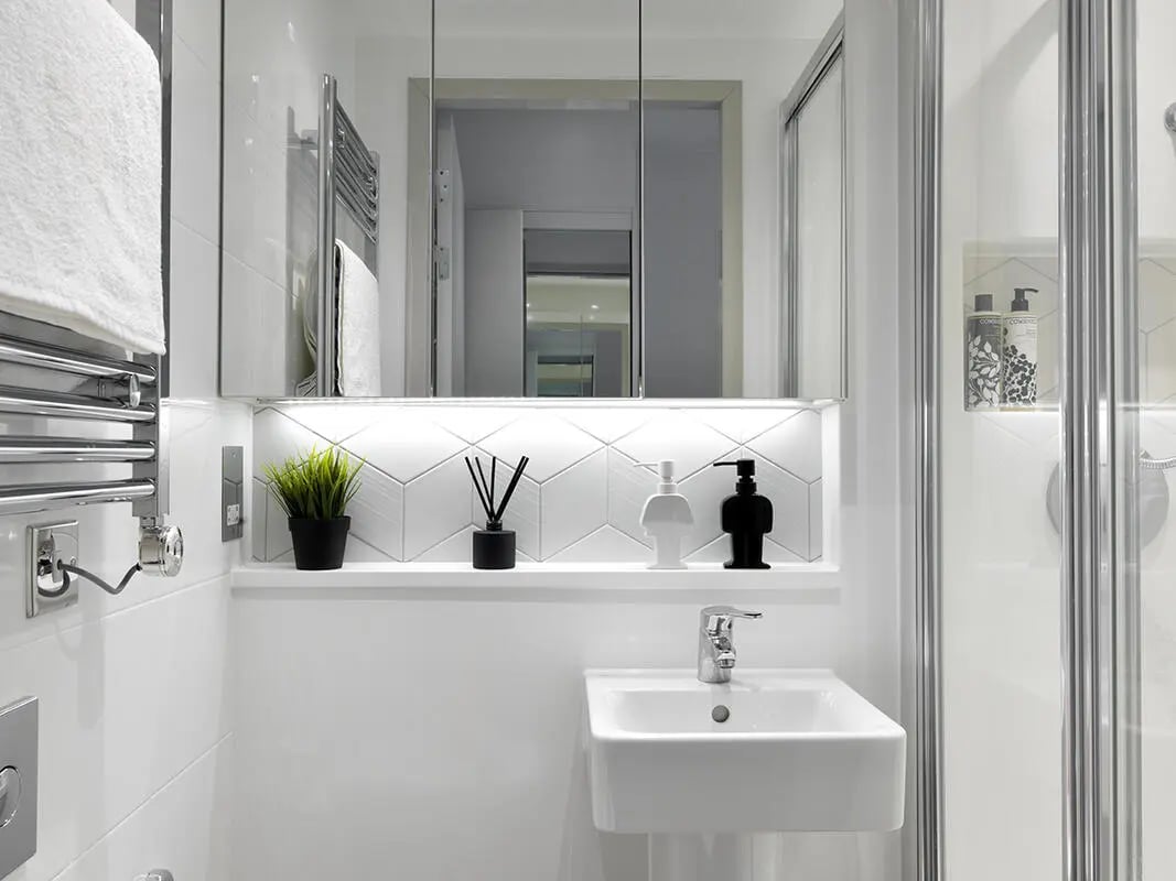 Sink plant soap dispenser reed diffuser bathroom at Student Castle Bath in Bath Student Accommodation