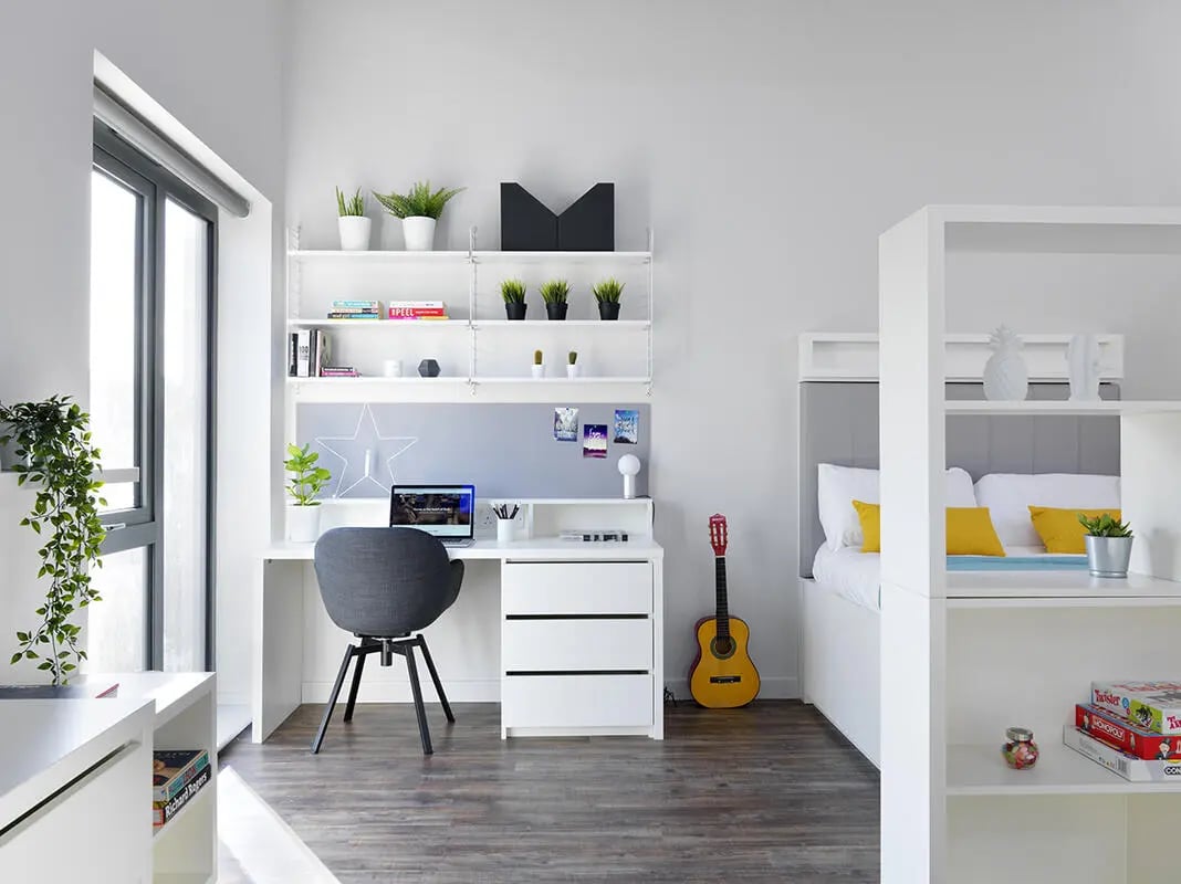 Desk chair laptop shelves guitar bed bedroom at Student Castle Bath in Bath Student Accommodation
