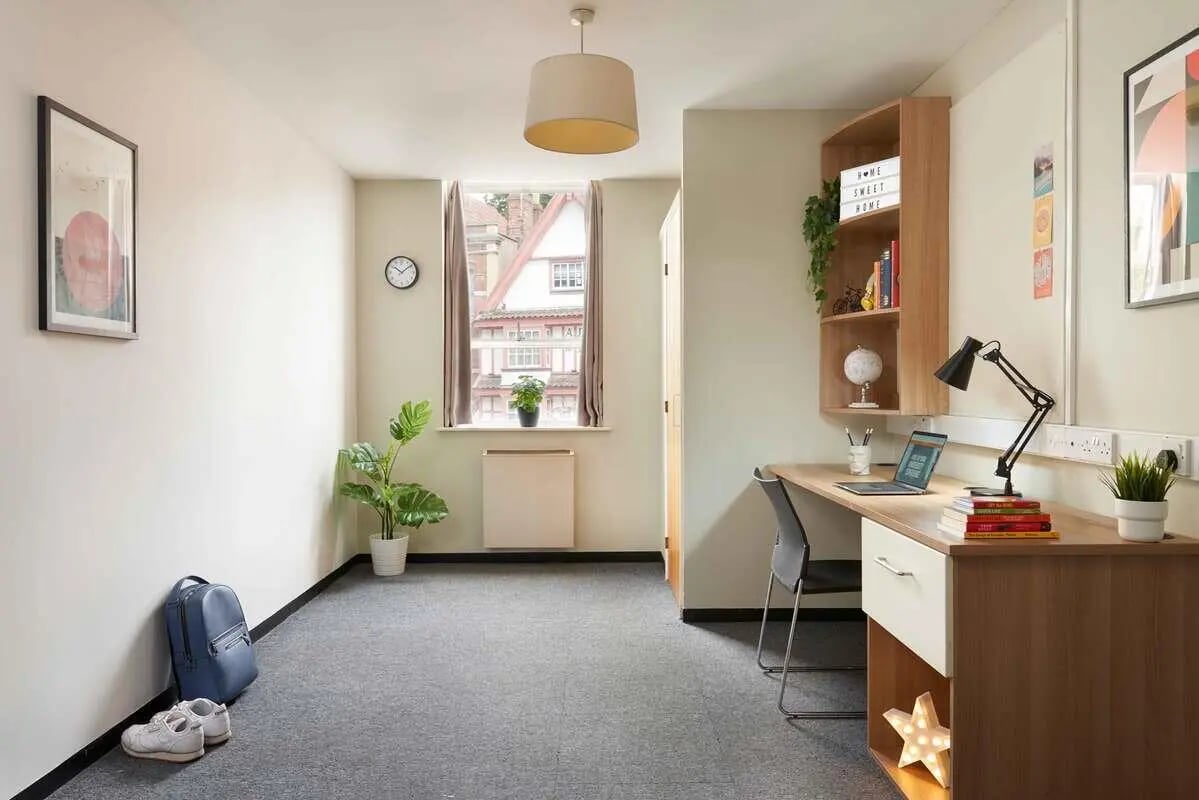 Desk with laptop books plant study area at Transom House in Bristol Student Accommodation