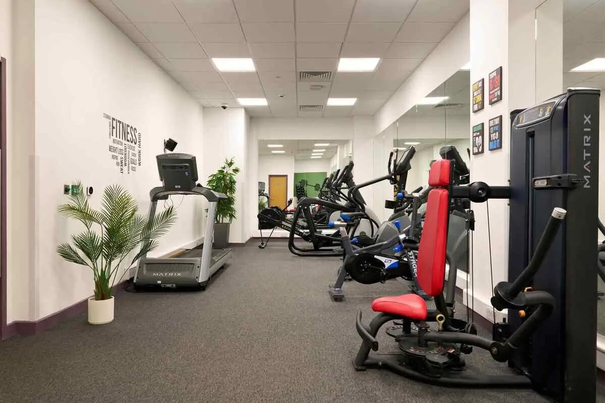 Gym with treadmills and weight machines fitness area at Westwood Student Mews in Coventry Student Accommodation