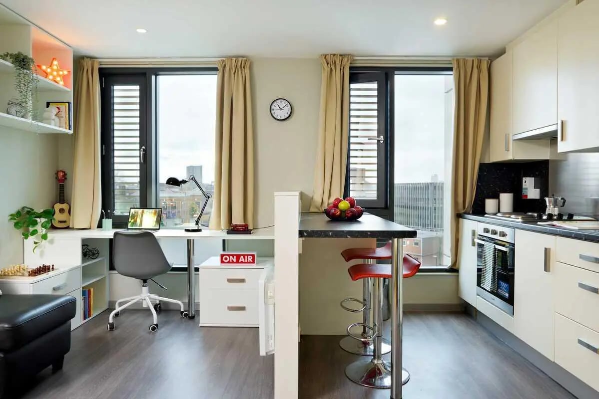 Desk kitchen bar stools with fruit living room at Millennium View in Coventry Student Accommodation